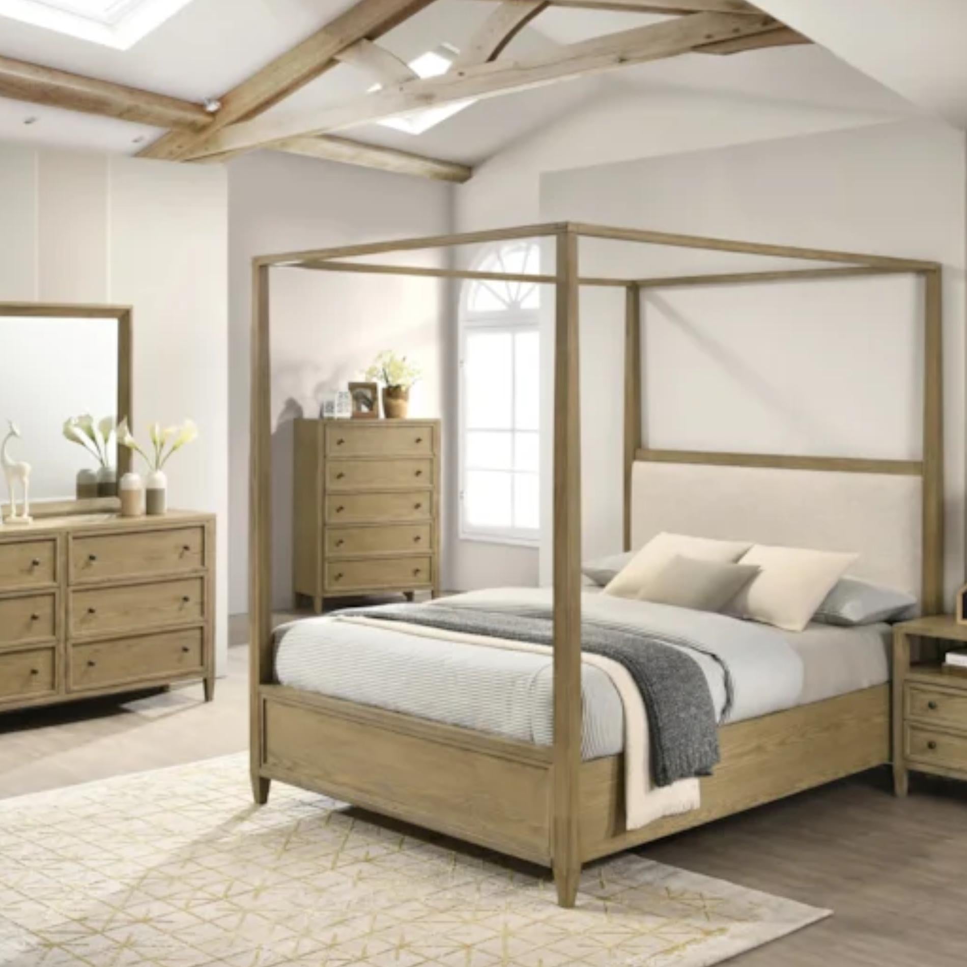 Wooden canopy bed in a bedroom setting with matching furniture.