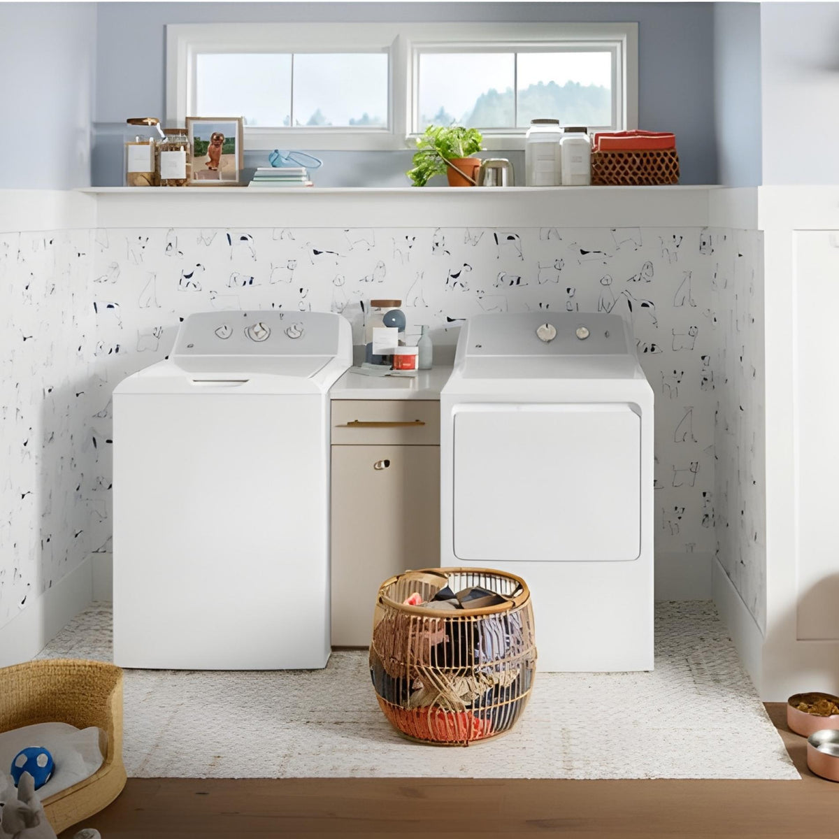 Modern laundry room with white washer and dryer against a patterned wall.