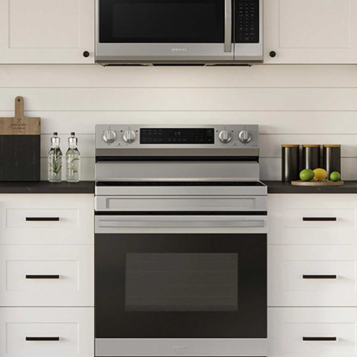 Stainless steel oven and microwave in a kitchen setting