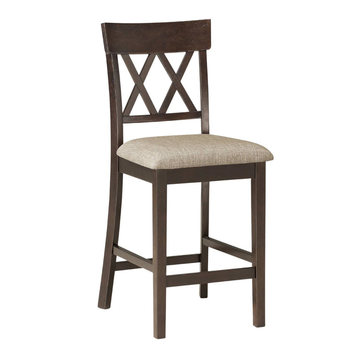 A wooden barstool with a dark brown frame, a high backrest featuring an X-shaped crisscross design, and a light beige upholstered seat cushion, shown against a plain white background.