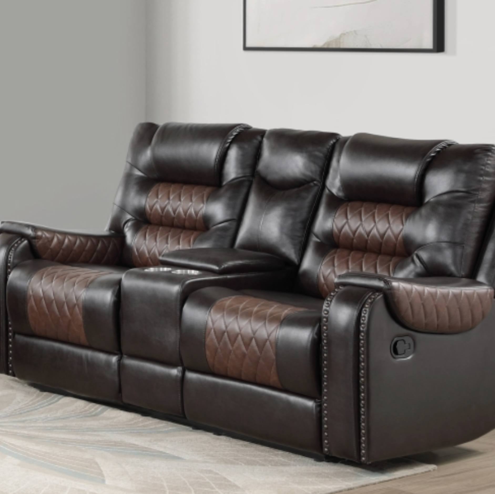 A three-seat power reclining loveseat sofa upholstered in dark brown leather with quilted brown accent panels on the seat and back cushions, shown in a living room setting.
