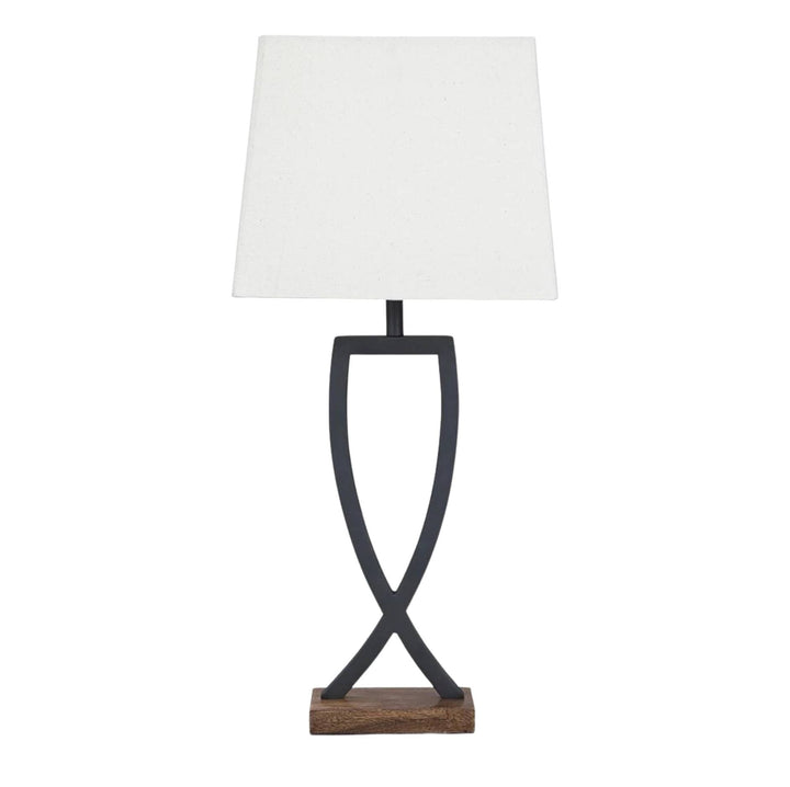 A table lamp with a white rectangular fabric shade, a dark metal sculptural base, and a small wooden base plate, shown on a plain white background.