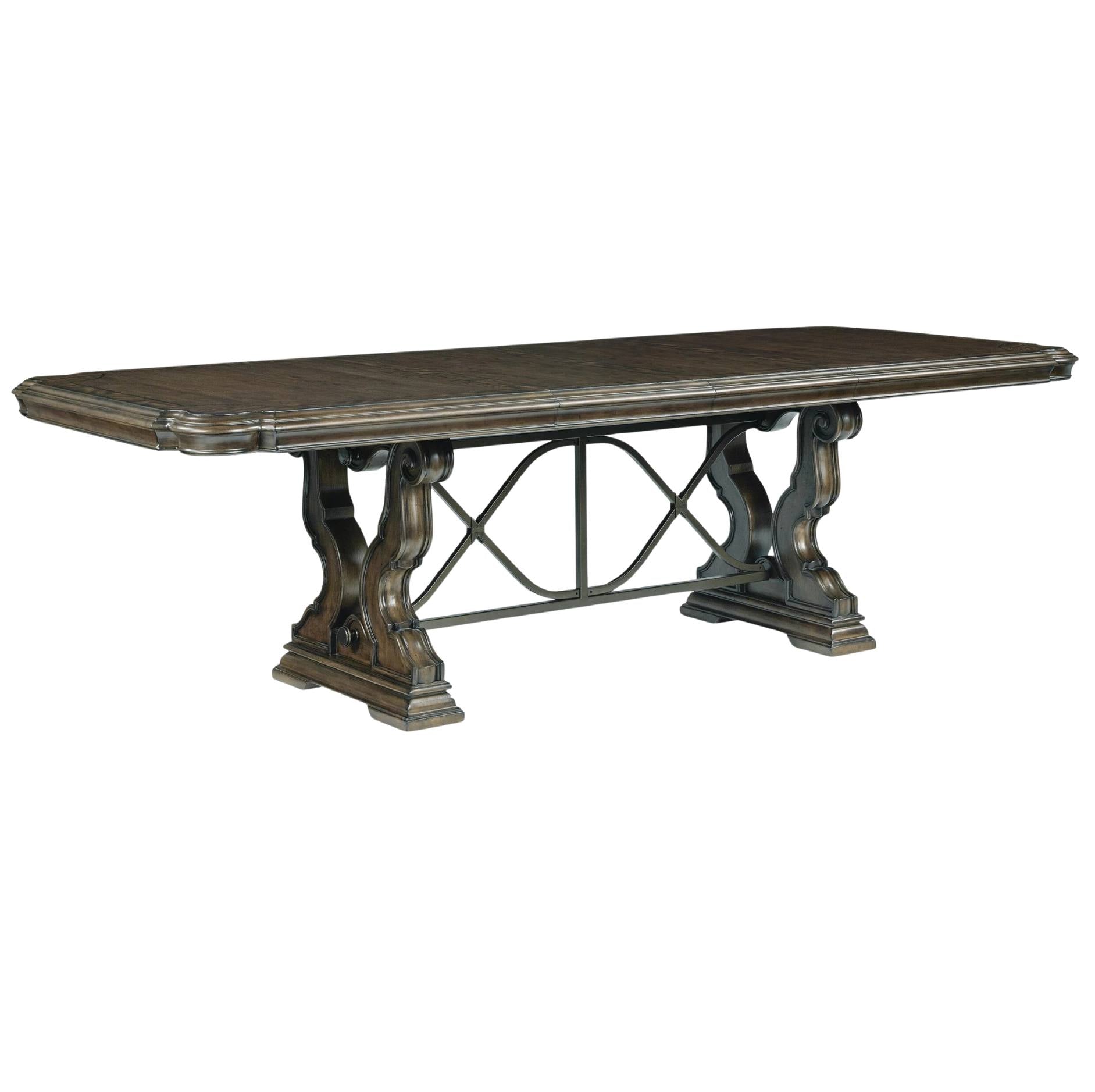 Wooden dining table with intricate legs on a white background