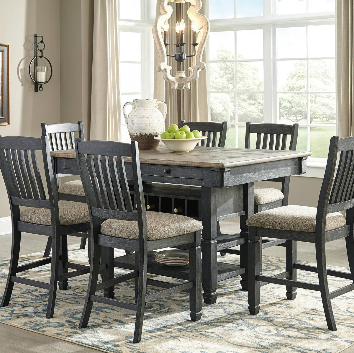 A 5-piece dining set featuring a rectangular dark gray wooden table with a light wood top and six matching high-back chairs with beige upholstered seats, shown in a bright dining room setting.