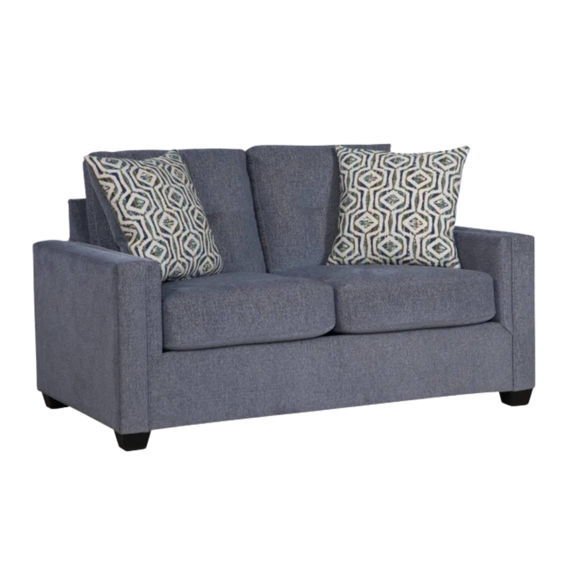 A two-seater loveseat sofa upholstered in textured slate blue fabric, featuring two patterned throw pillows with a geometric design in beige, gray, and blue, set against a plain white background.