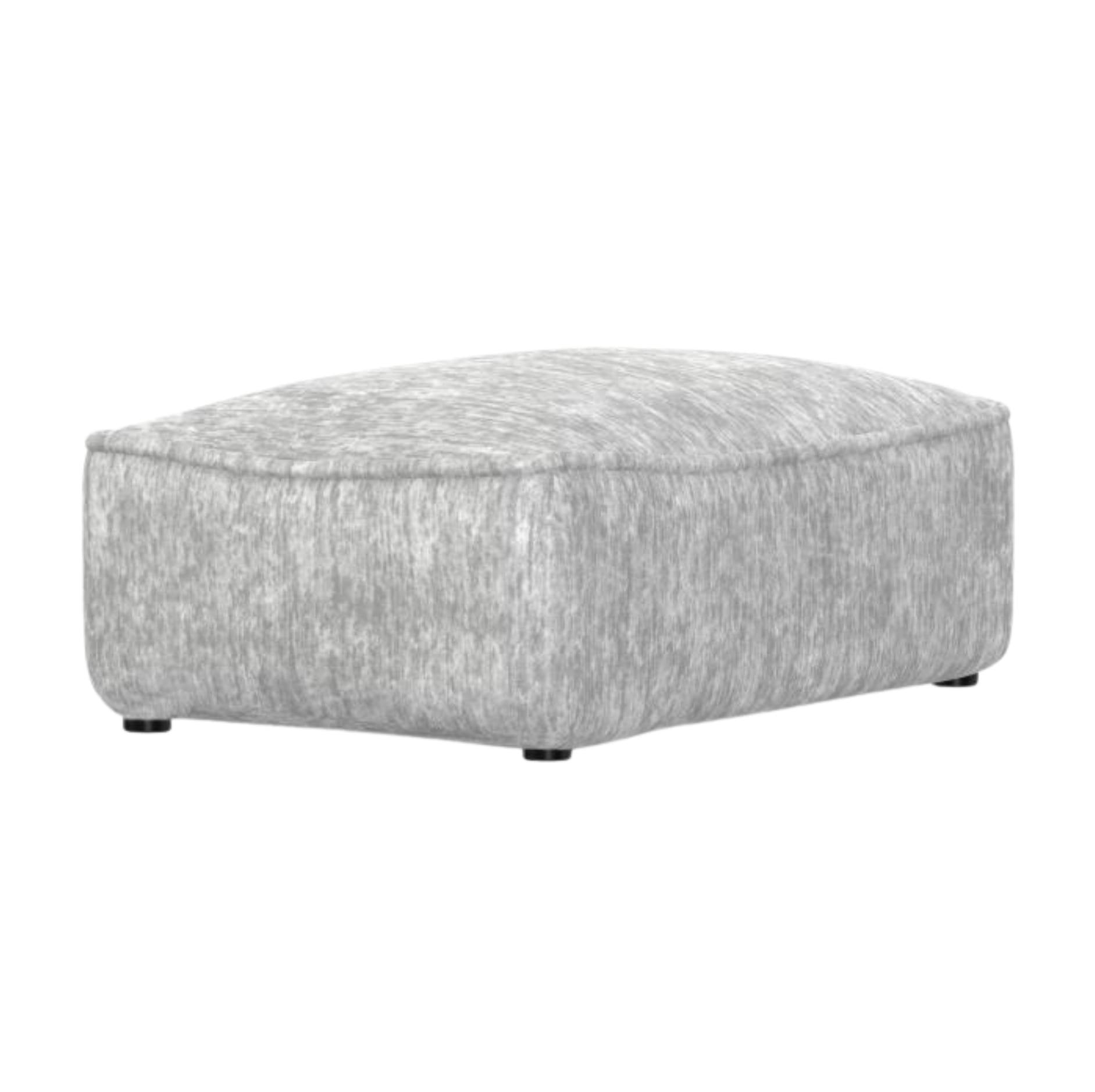 A modern rectangular ottoman upholstered in a textured light gray fabric, shown from a three-quarter angle on a plain white background.