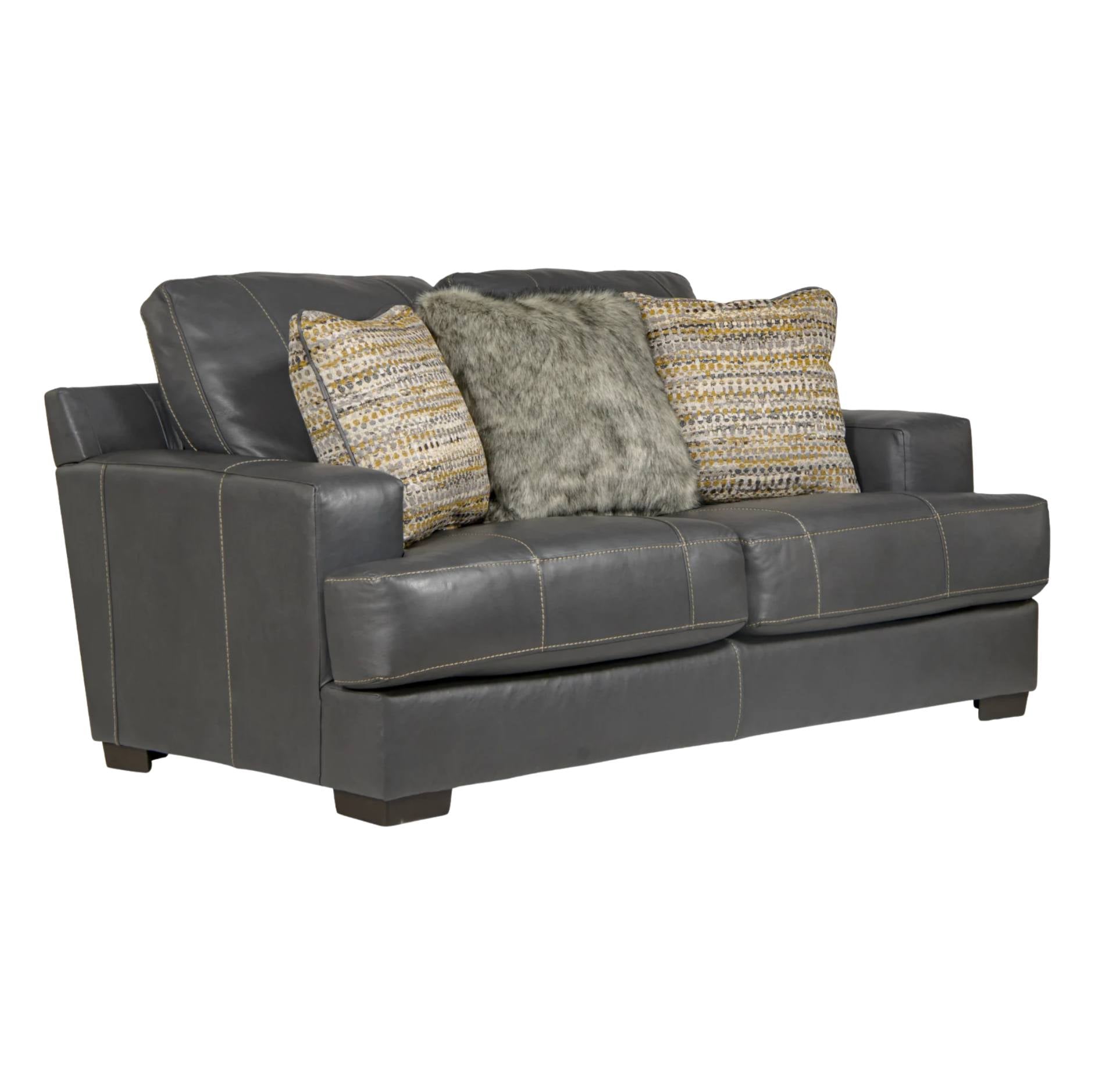 A dark gray leather loveseat sofa with three decorative throw pillows, including two textured woven pillows and one gray faux fur pillow, shown against a plain white background.