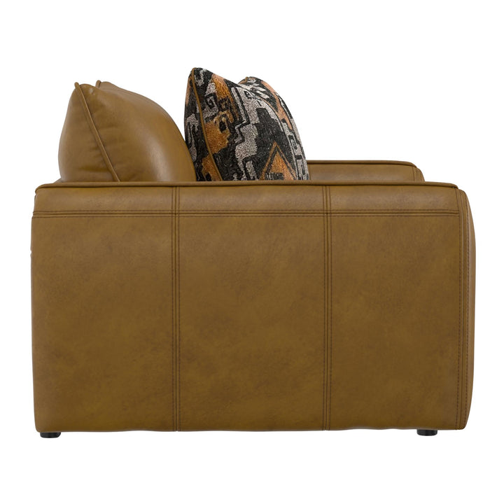 Brown leather sofa with a patterned pillow on a white background