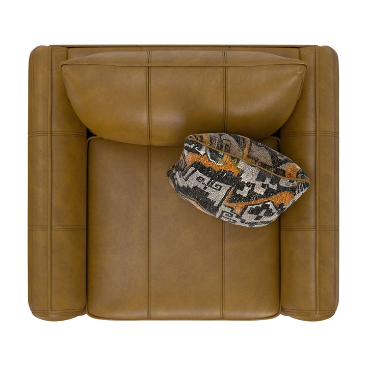 Brown leather armchair with a patterned fabric item on a white background