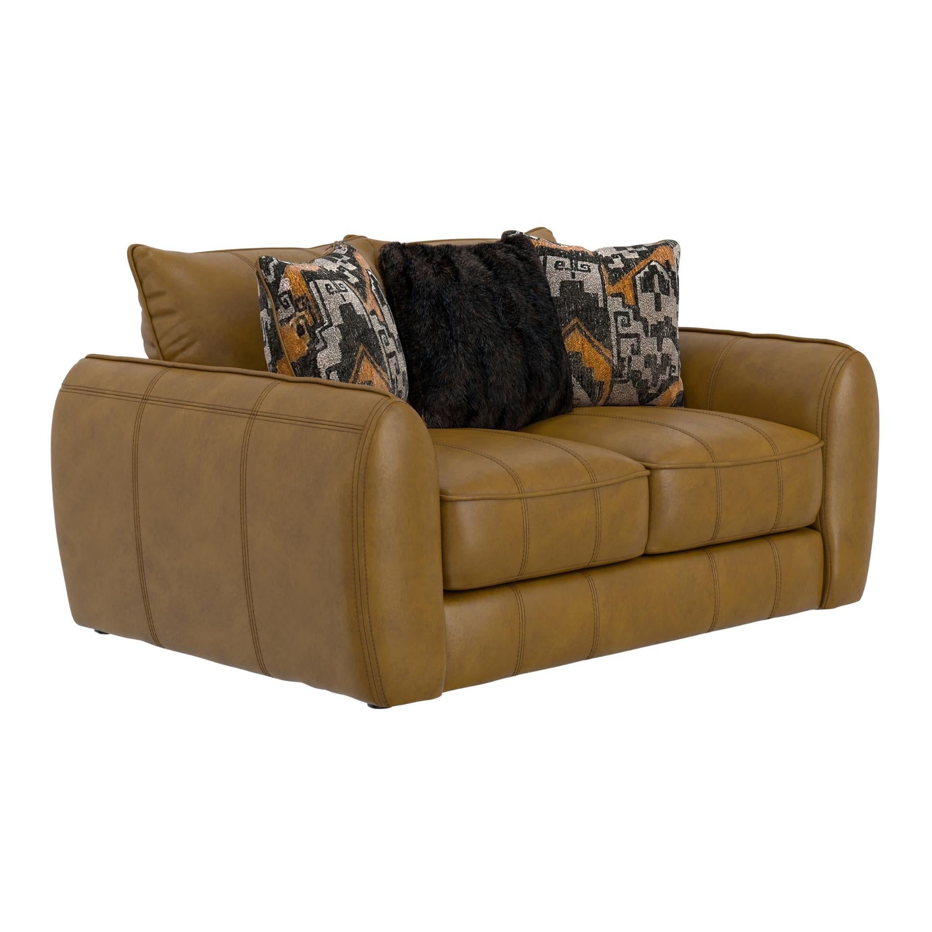 Brown leather sofa with patterned and black pillows on a white background