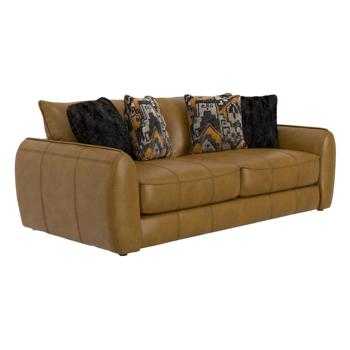 Brown leather sofa with patterned and solid color cushions on a white background