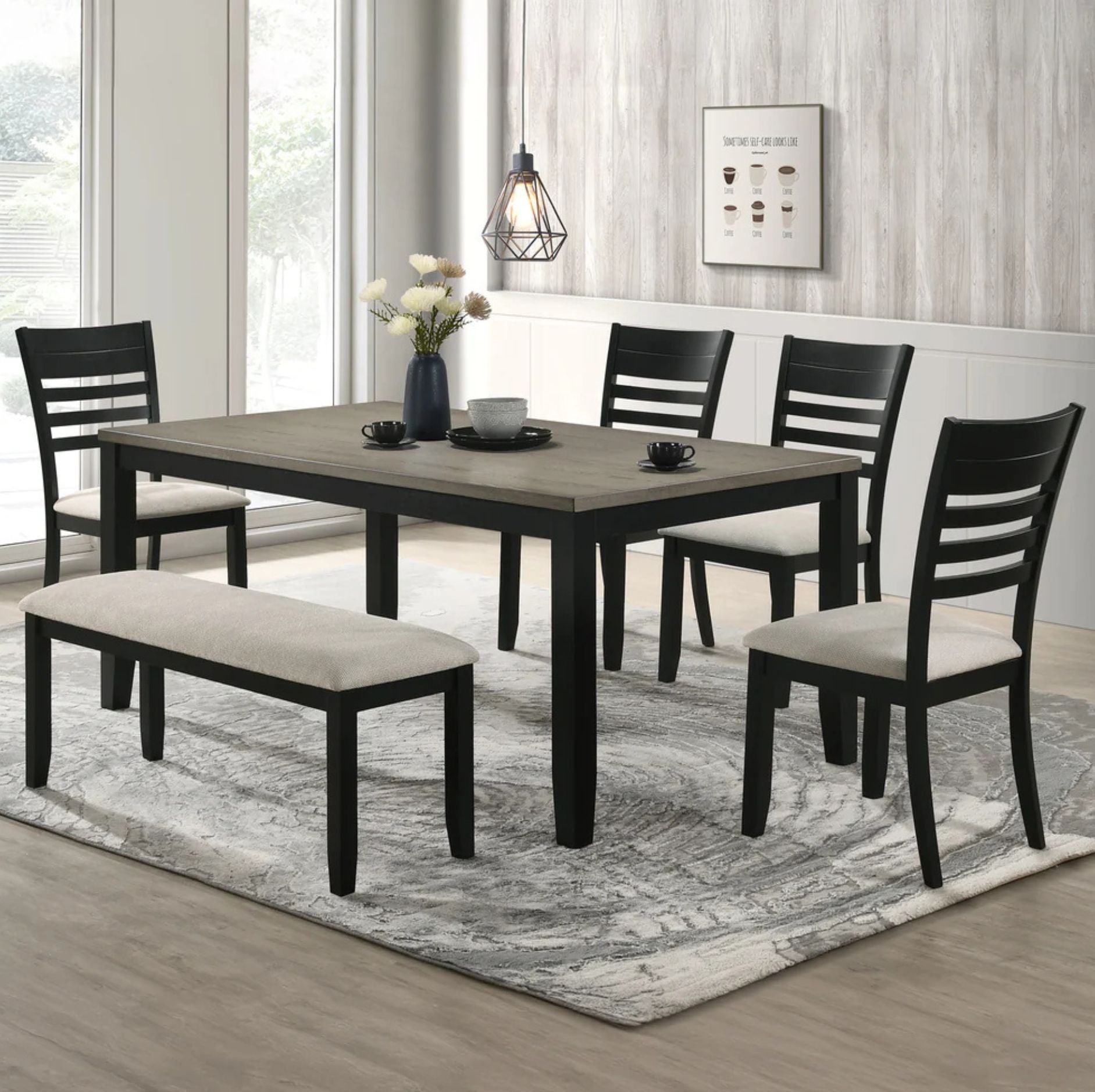A 5-piece dining room set featuring a rectangular dark wood table, four black ladder-back chairs, and a matching bench with cream upholstered seats, arranged on a gray patterned area rug in a bright dining room.