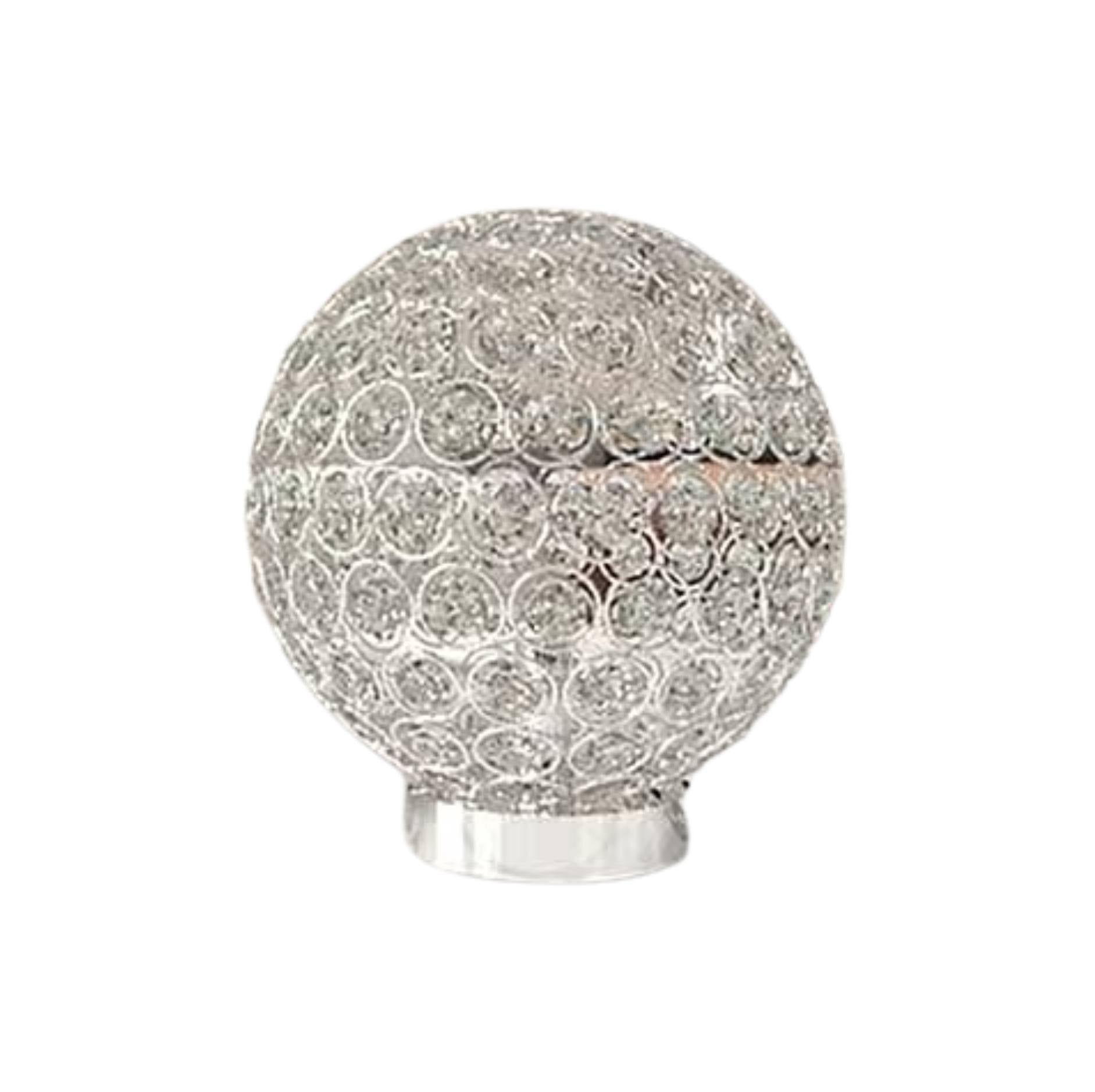 A spherical silver-toned decorative lamp or light fixture with an intricate openwork circular pattern and a metallic base, shown on a plain white background.