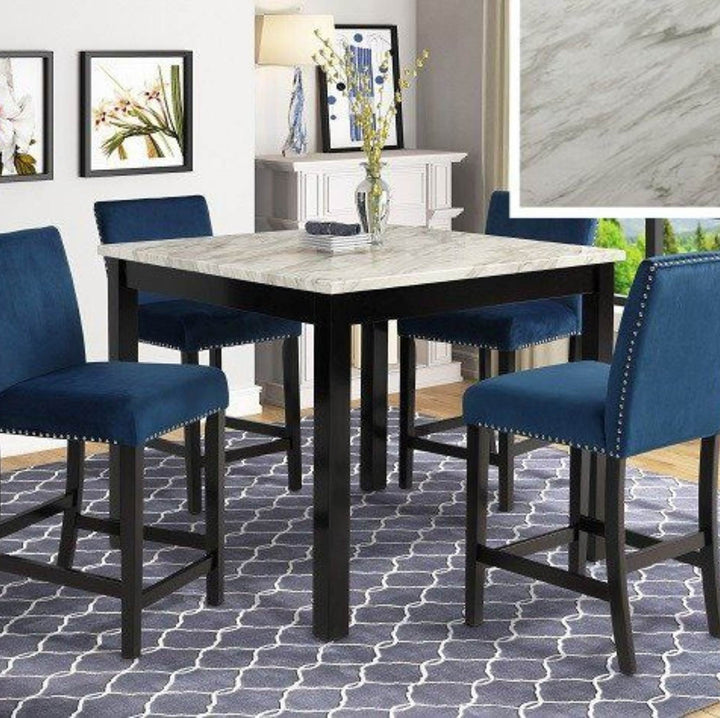 A 5-piece bar-height dining set featuring a square table with a light gray marble-patterned top and black frame, surrounded by four blue upholstered stools with dark wood legs.