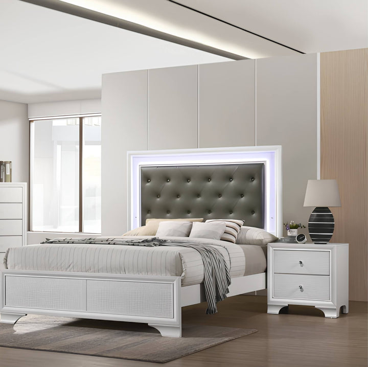 A modern bedroom featuring a white bed frame with a dark gray tufted headboard and integrated LED backlighting, styled with neutral bedding and flanked by matching white nightstands.