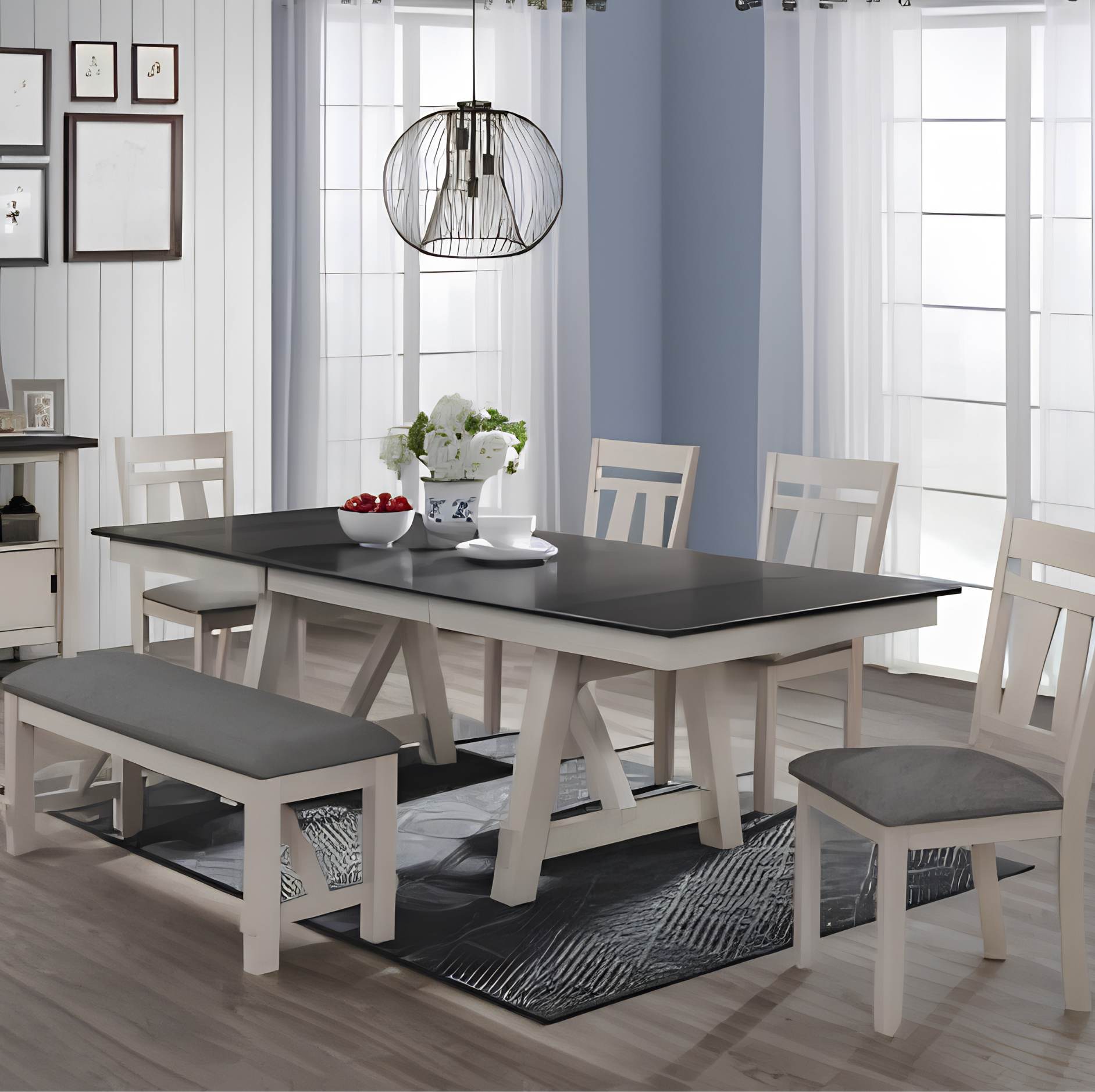 A 5-piece dining room set featuring a rectangular table with a black top and white frame, four matching white chairs with gray cushions, and a white bench with a gray cushion, styled in a bright dining room.