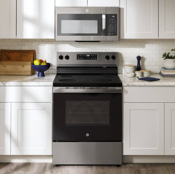 Stainless steel oven and microwave in a kitchen setting