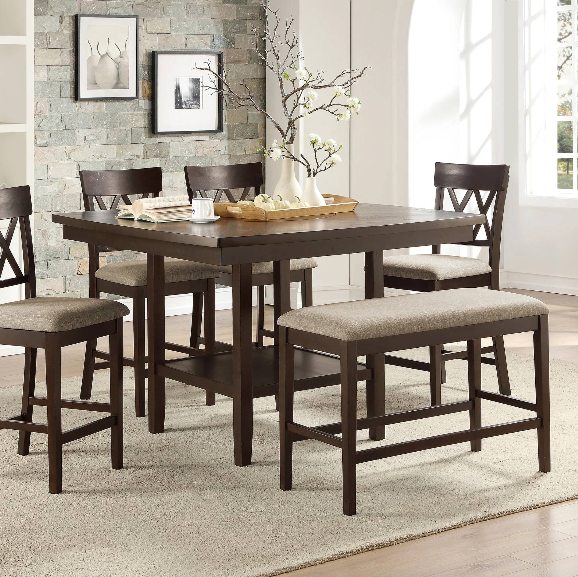 A 5-piece counter height dining set featuring a rectangular dark brown wood table, four matching chairs with upholstered seats, and a matching bench, shown in a bright dining room setting.