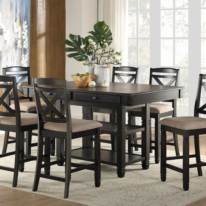 Dining room with a dark wood table and chairs in a well-lit room.