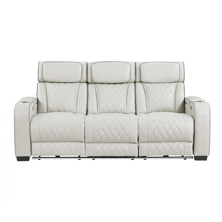 Gray sofa with quilted pattern on a white background