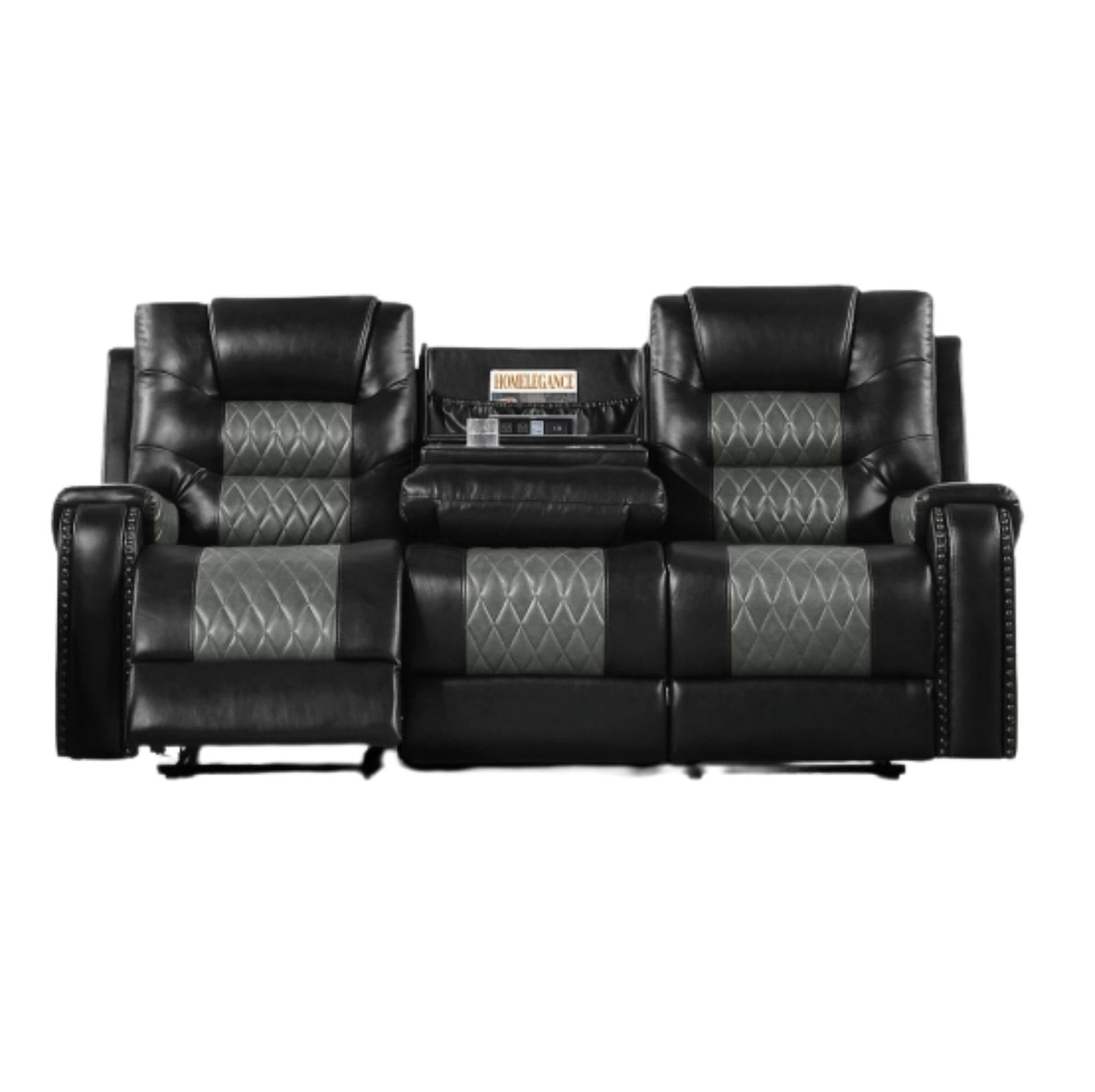 A black leather reclining loveseat sofa with two separate seats, diamond-quilted gray inserts on the seat and back cushions, and a central console table holding a stereo receiver.