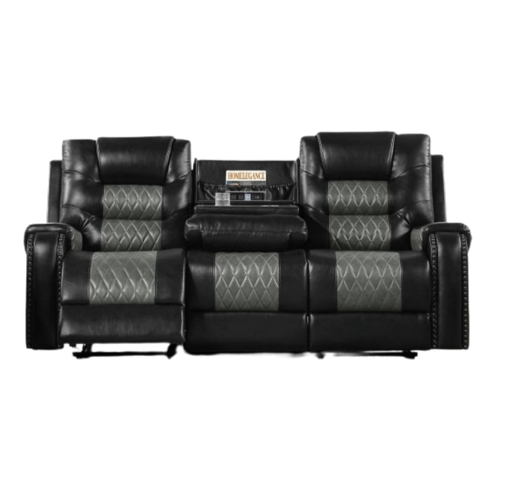 A black leather reclining loveseat sofa with two separate seats, diamond-quilted gray inserts on the seat and back cushions, and a central console table holding a stereo receiver.