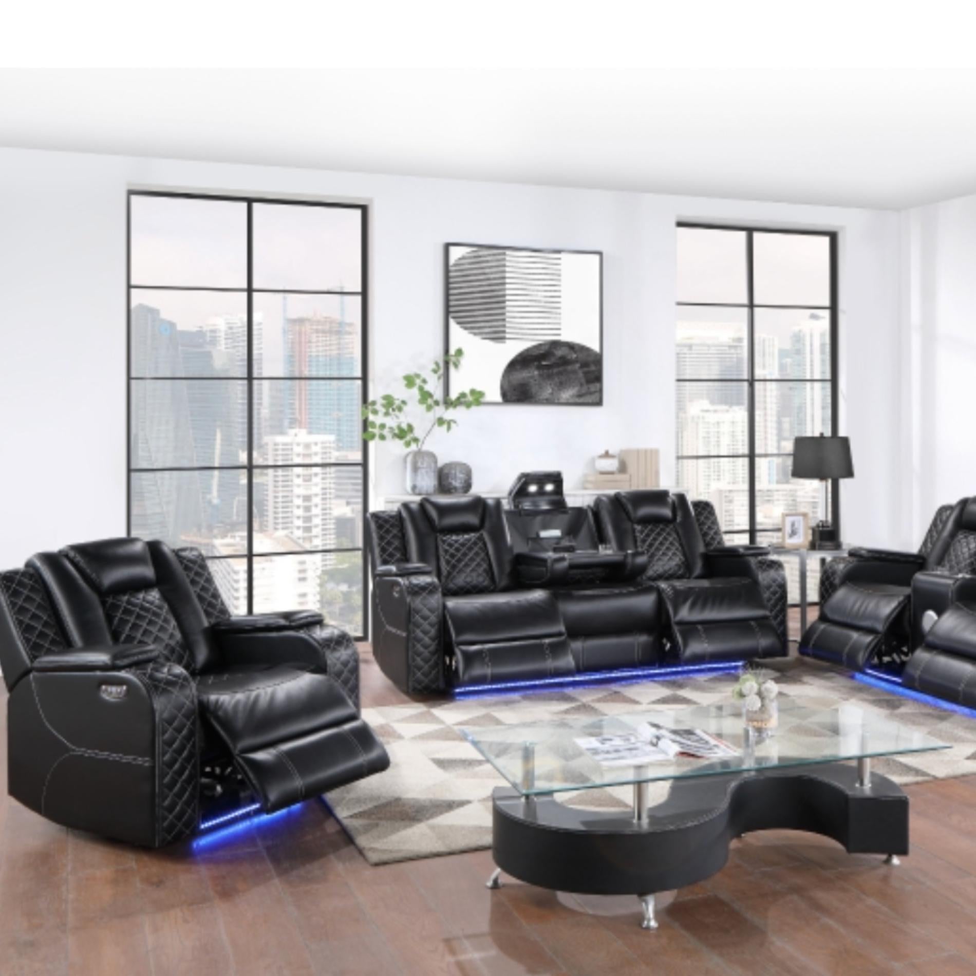 Modern black leather recliner sofa set in a stylish living room with large windows.
