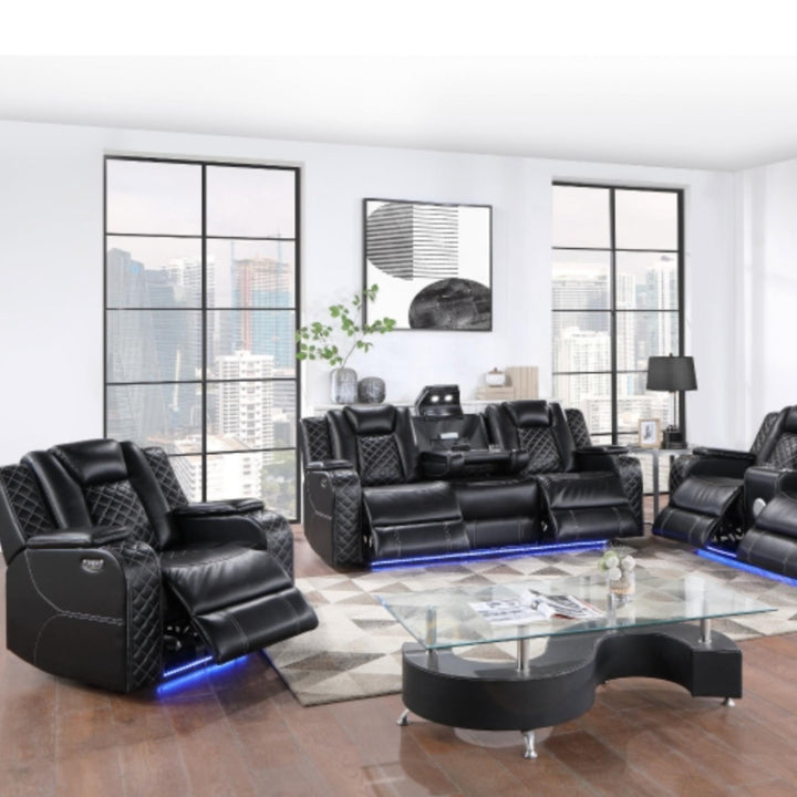 Modern black leather recliner sofa set in a stylish living room with large windows.