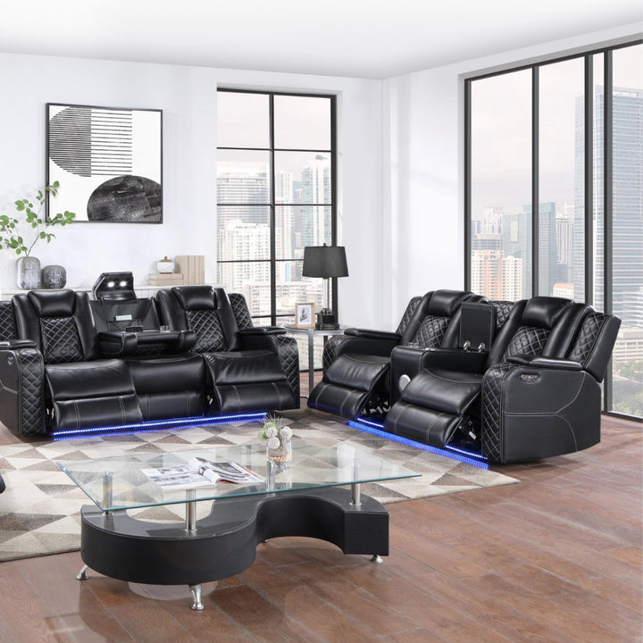 Modern black leather recliner sofa set in a stylish living room with large windows.