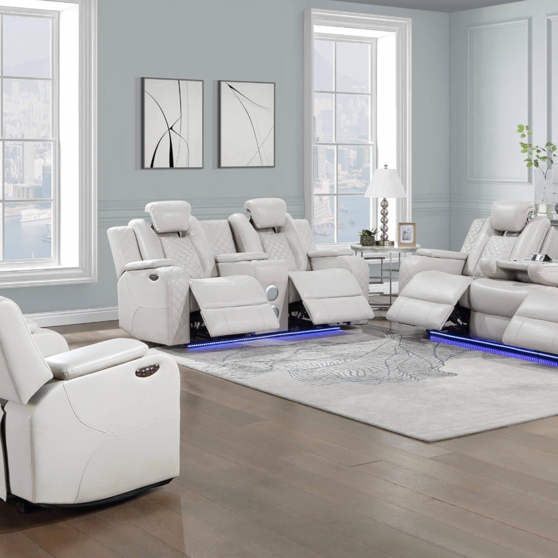 Modern living room with white recliner chairs and light blue walls.