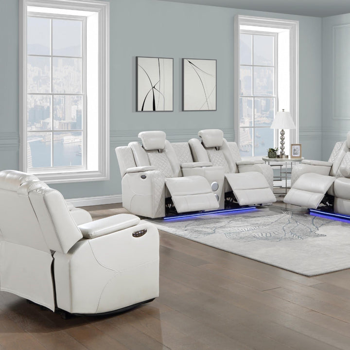 White recliner chairs in a modern living room with light gray walls and large windows.