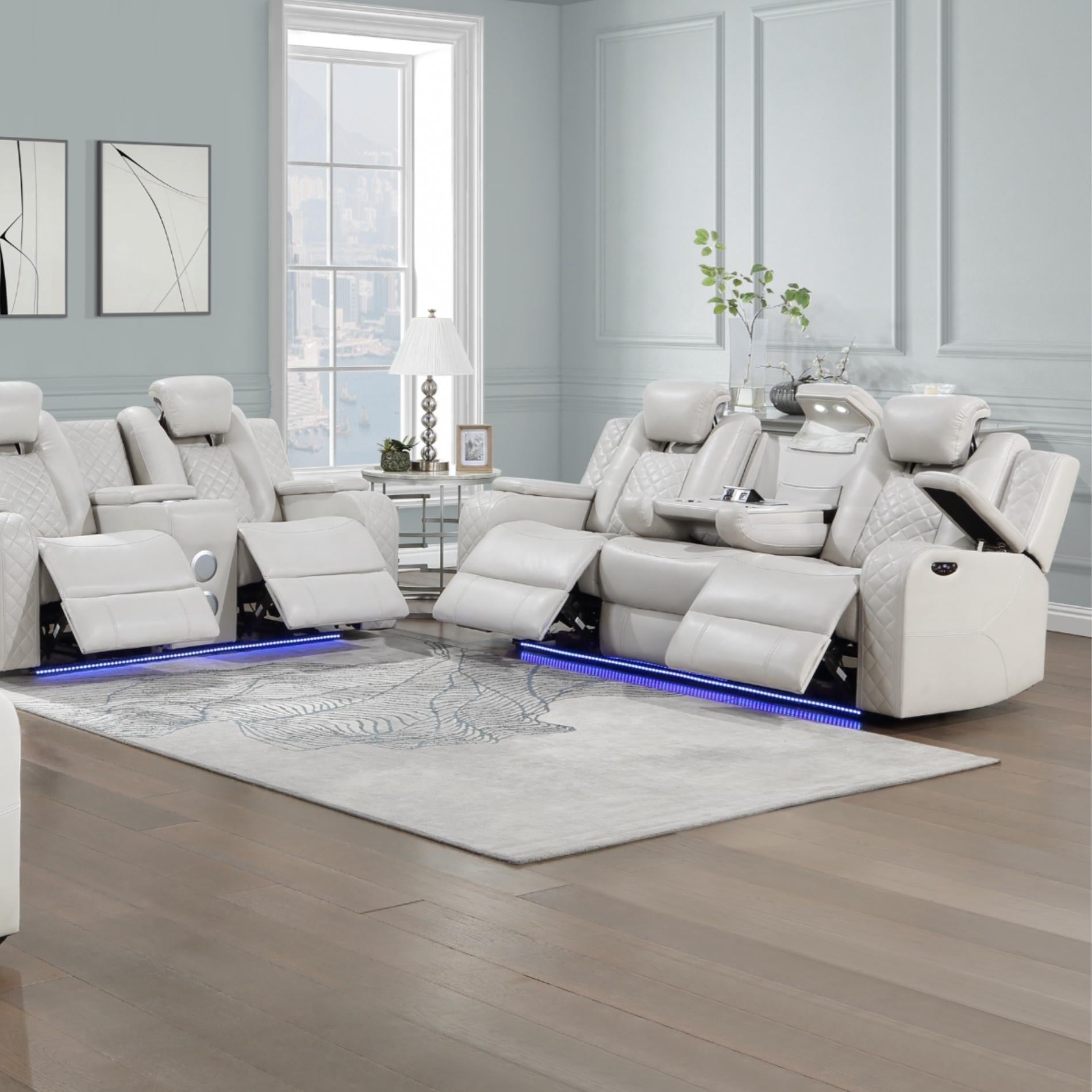 Modern living room with a large white reclining sofa set.
