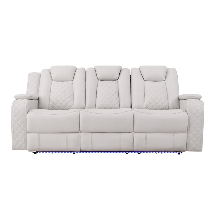 Gray sofa with quilted pattern on a white background