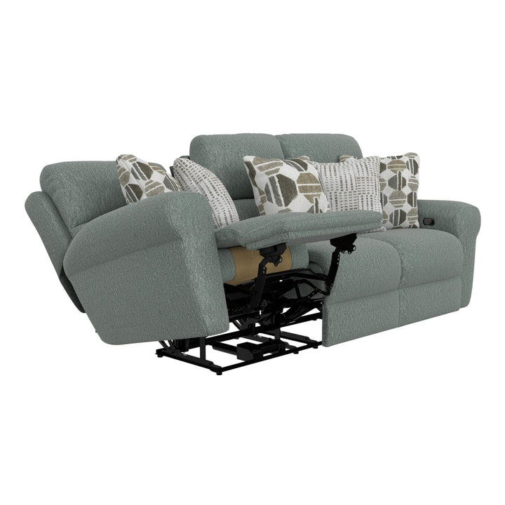 Gray recliner sofa with patterned cushions on a white background