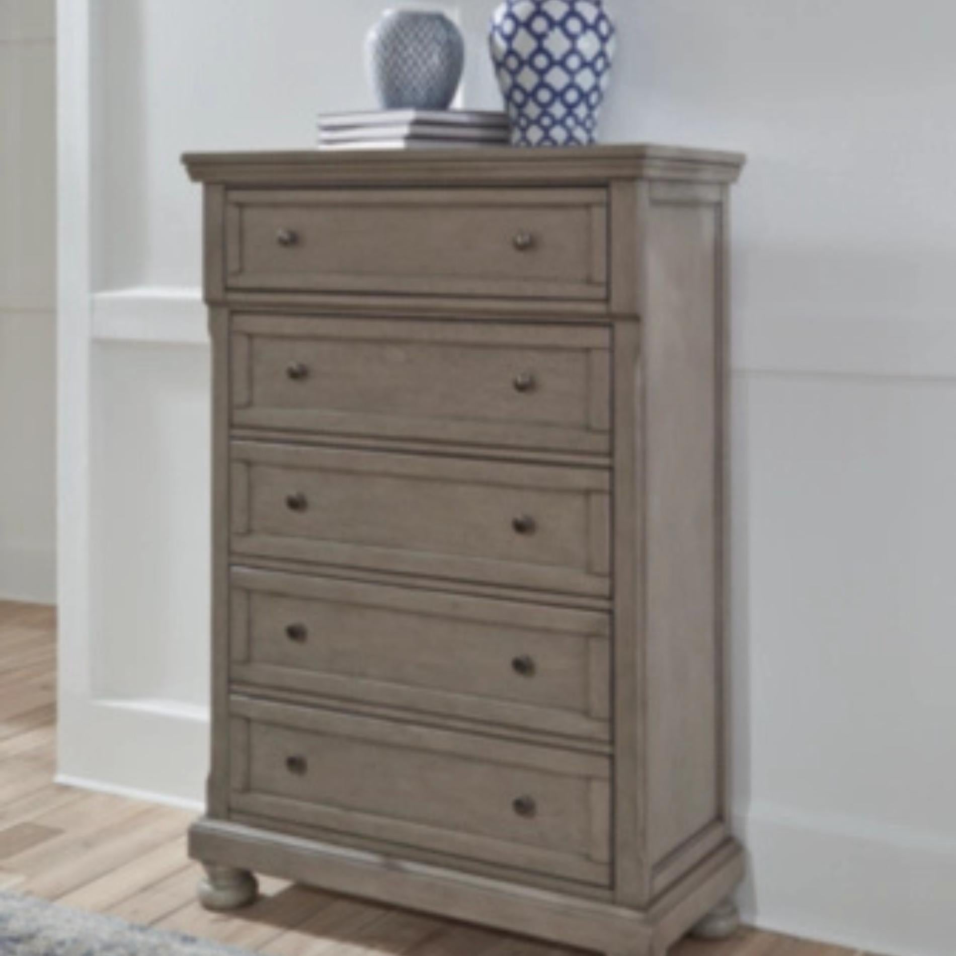 Wooden dresser with four drawers in a room setting