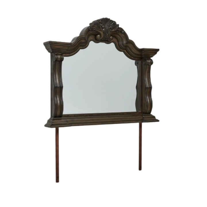 Decorative wooden mirror with intricate carvings on a white background