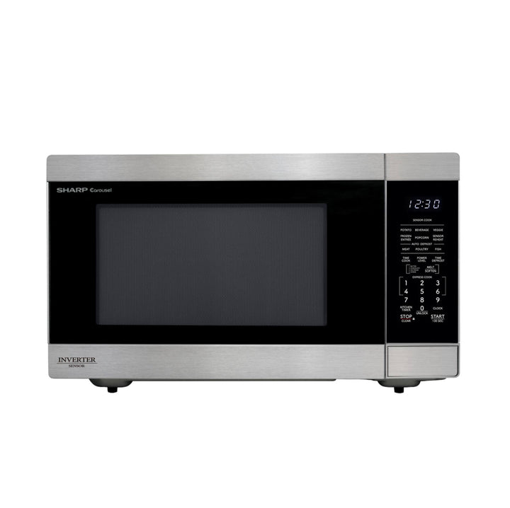 A compact countertop microwave oven with a brushed stainless steel exterior, black glass door window, and a digital control panel on the right side. The brand name Sharpie is visible on the upper left of the door, and Invister is printed on the lower left front panel.